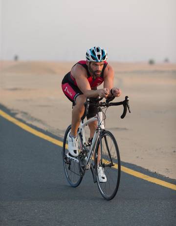 Fitness First member riding a bicycle Fitness First member riding a bicycle