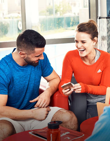 two Fitness First members laughing