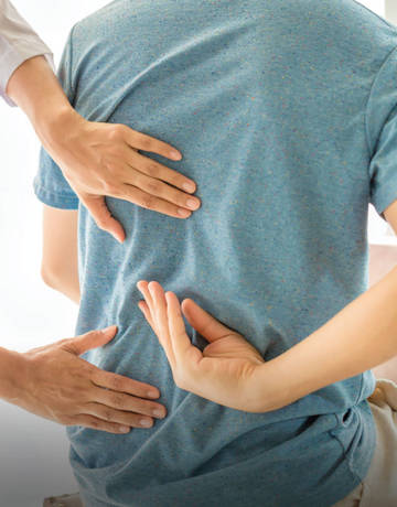 checking on a patient's back pain