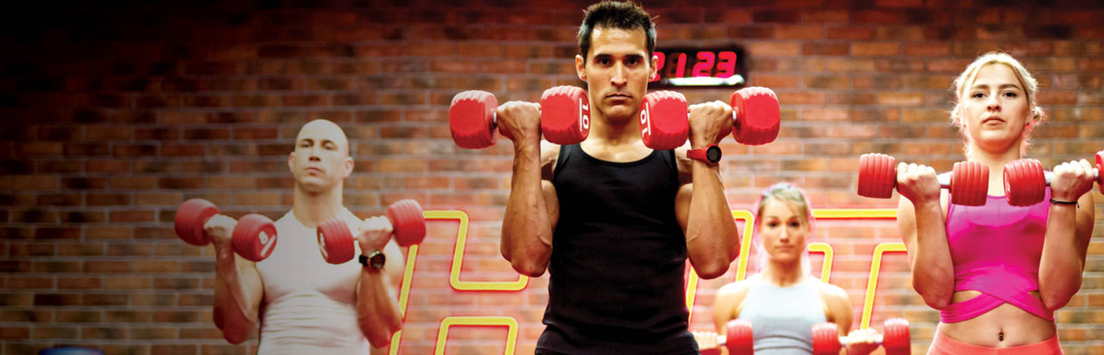 Fitness First group dumbbell weight lifting